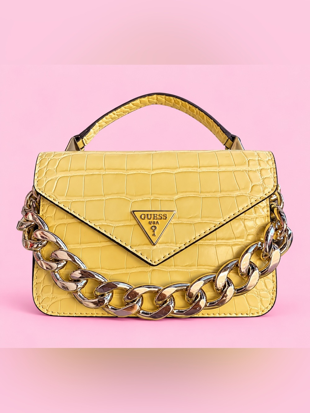 GUESS Retour Mini Top Handle Flap bag in a striking yellow